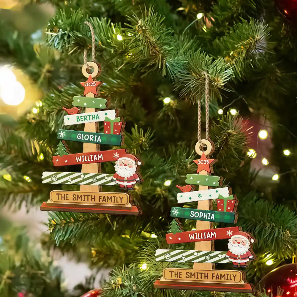 Two Christmas tree ornaments with custom name 'The Smith Family' on a decorated Christmas tree.