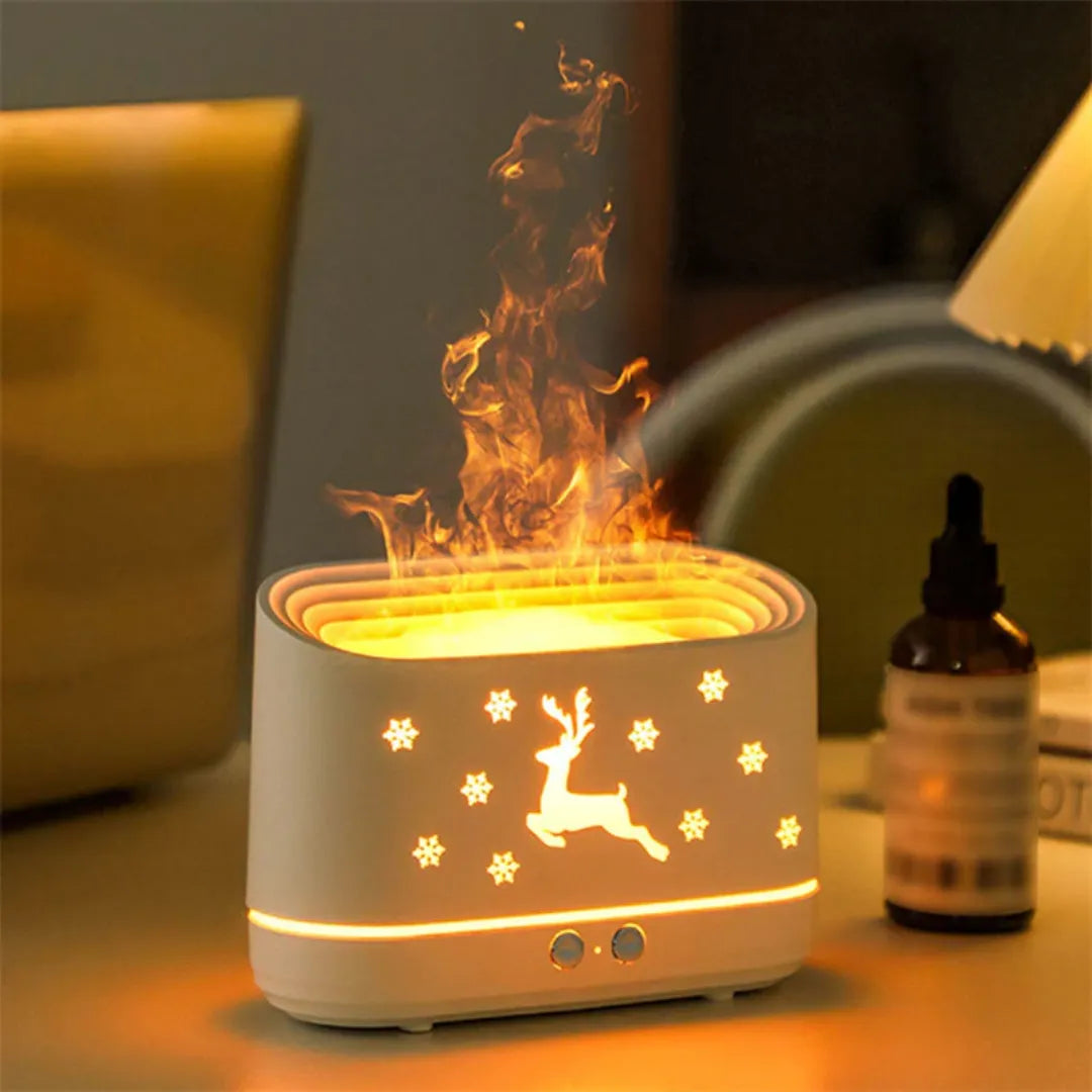 White essential oil diffuser with reindeer design on a table, emitting steam, flame effect, elk design for chirstmas decoration
