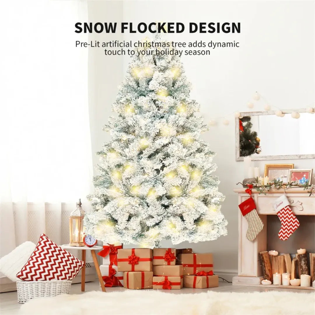 Snow-flocked artificial Christmas tree with lights in a living room setting.